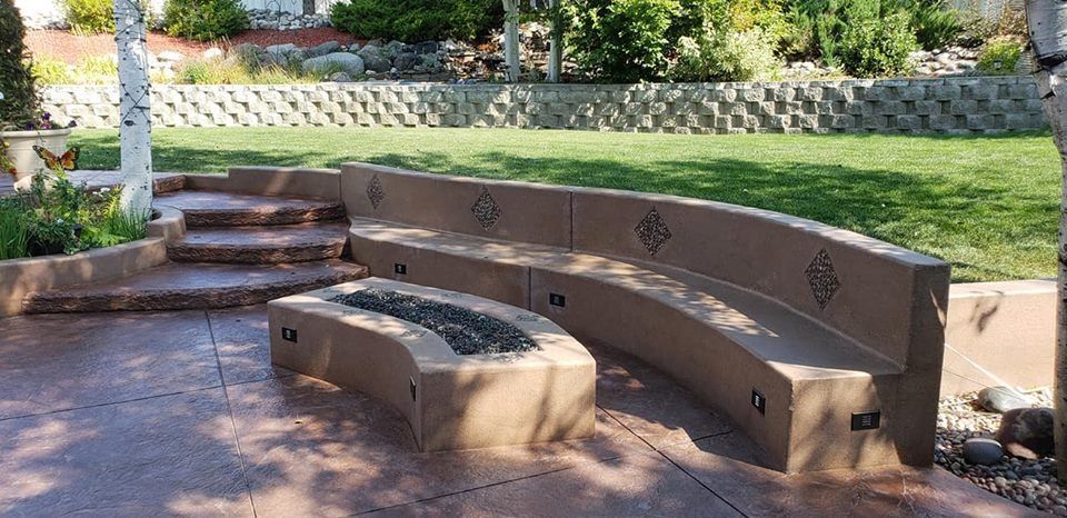 There is a fire pit in the middle of the patio.