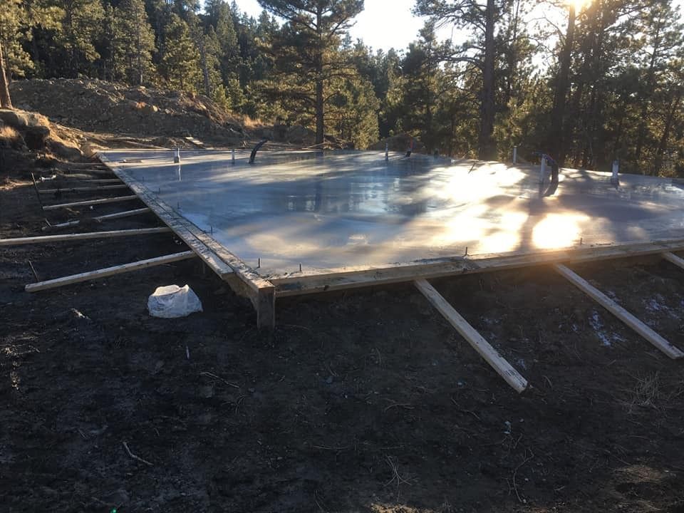 A large concrete slab in the middle of a forest