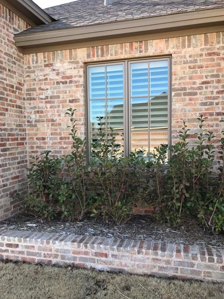 A Brick House With A Window With Blinds On It – Lubbock, TX – Wilson Blind & Shutter