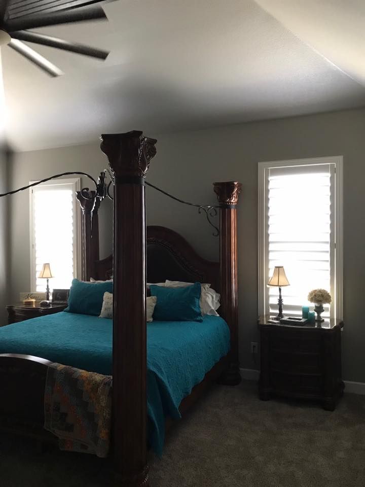 A Bedroom With A Four-Post Bed And A Ceiling Fan – Lubbock, TX – Wilson Blind & Shutter