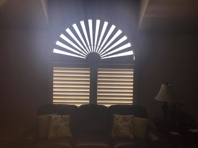 A Living Room With A Fan Shaped Window And Shutters – Lubbock, TX – Wilson Blind & Shutter