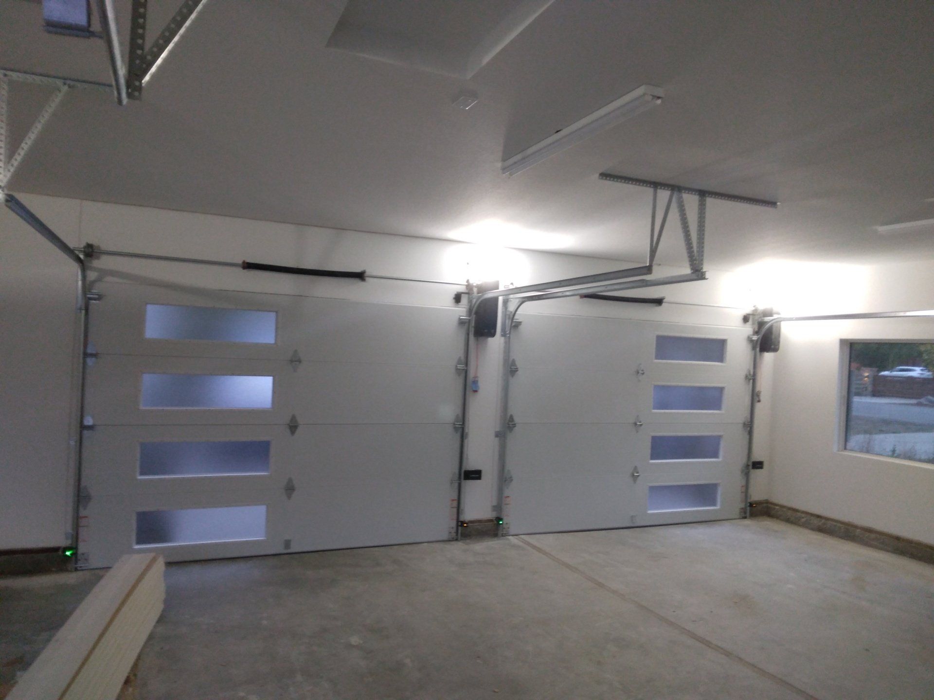 The inside of a double glass garage door installation in the Greater Bay area by Garage Door Excellence