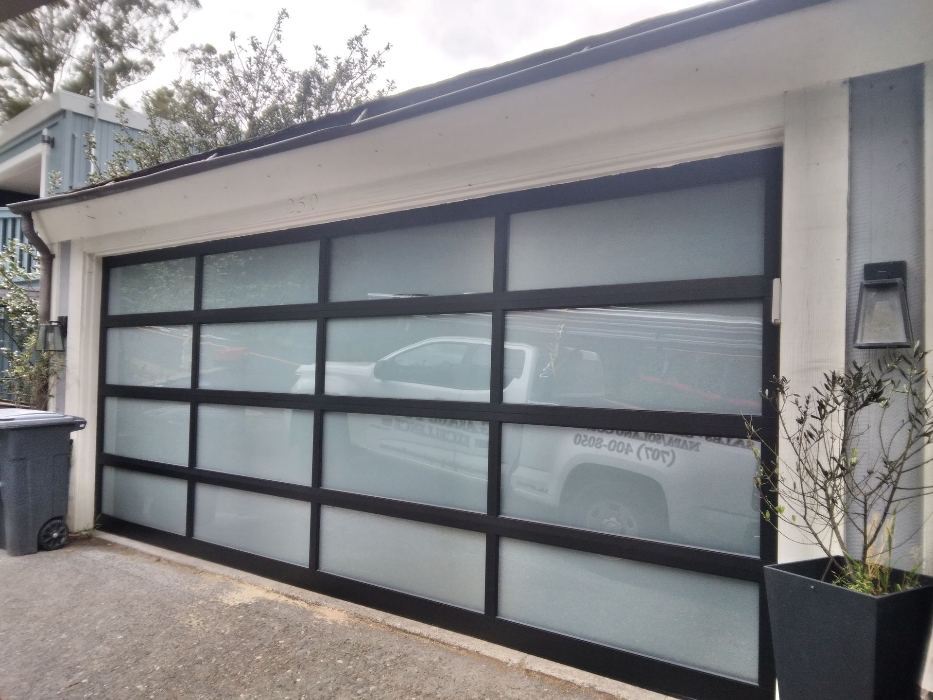 The outside view of a frosted glass garage door installation in Fairfield, CA by Garage Door Excellence