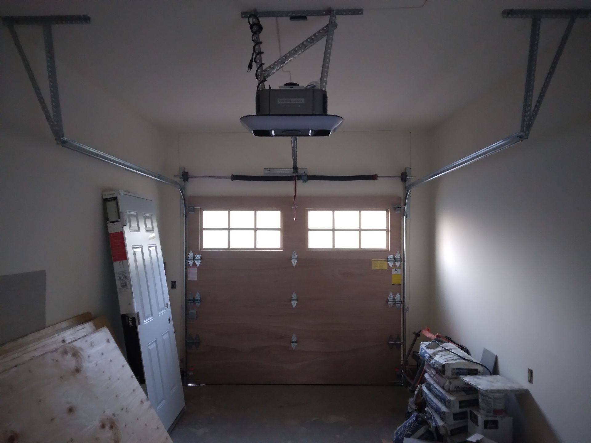 The inside of a residential garage door installation in the Greater Bay area provided by Garage Door Excellence