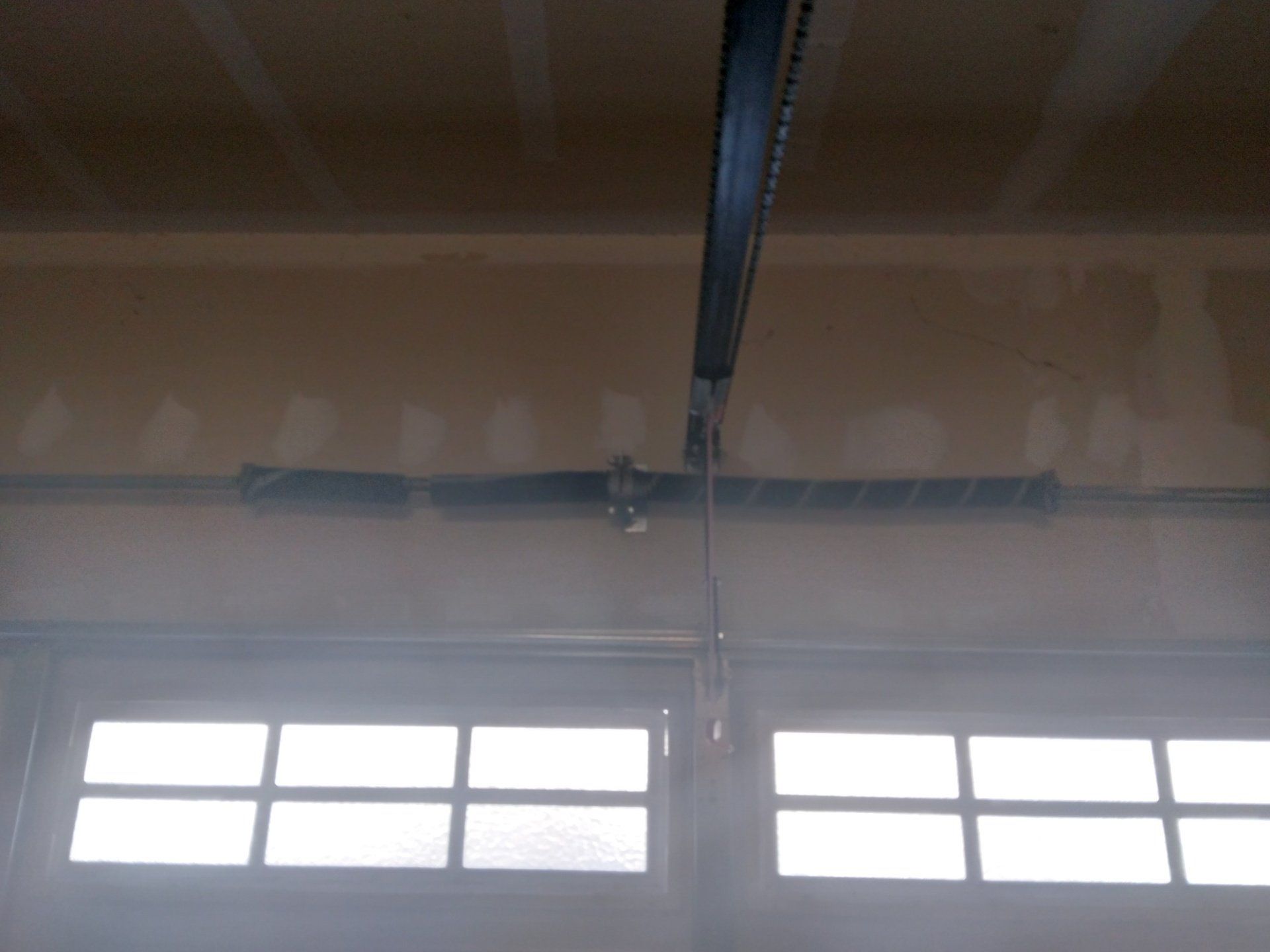The inside of a garage spring service in the Greater Bay area by Garage Door Excellence