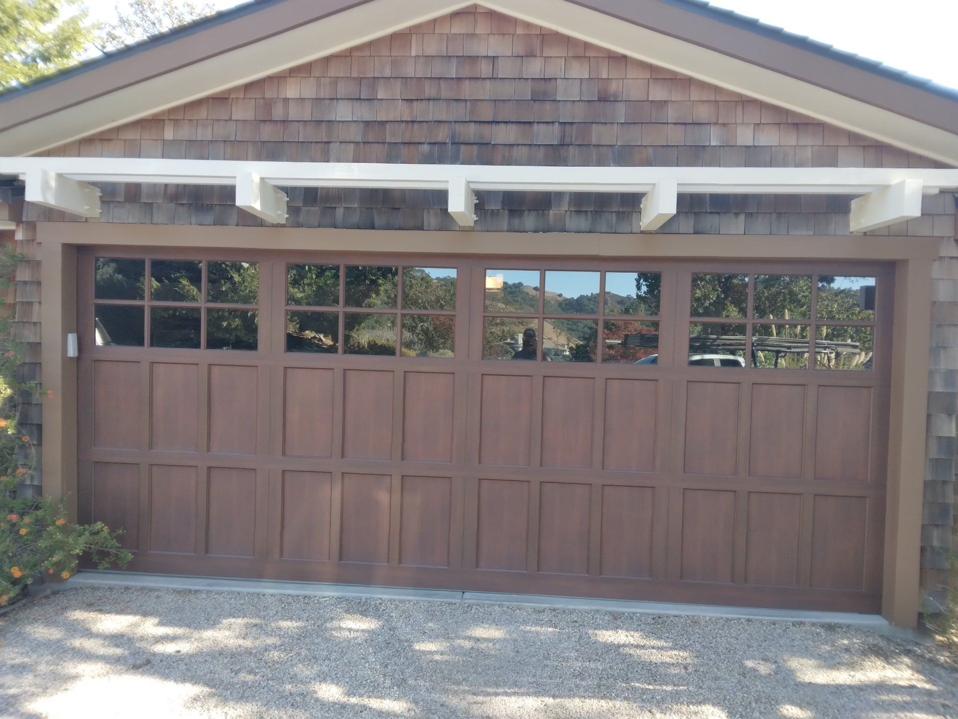 A wooden garage door being serviced by Garage Door Excellence in Fairfield, CA