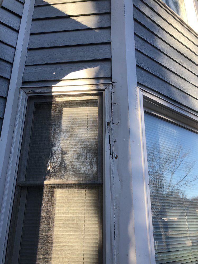 A close up of a window on the side of a house.