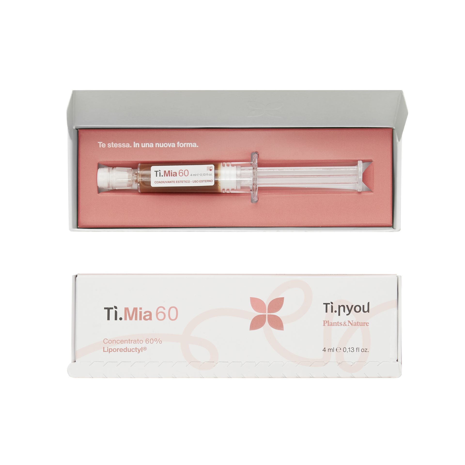 Una siringa in una scatola con sopra un fiore.