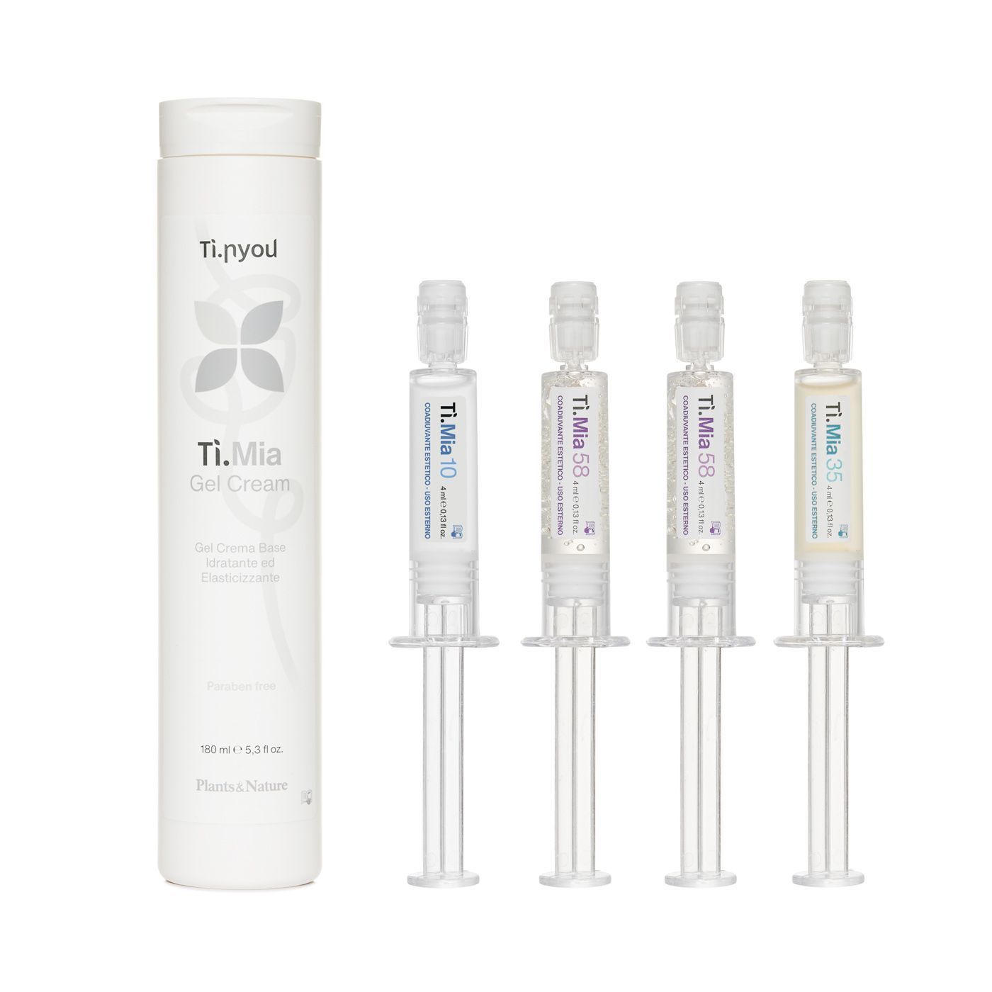 Ci sono quattro siringhe accanto a una bottiglia di shampoo.