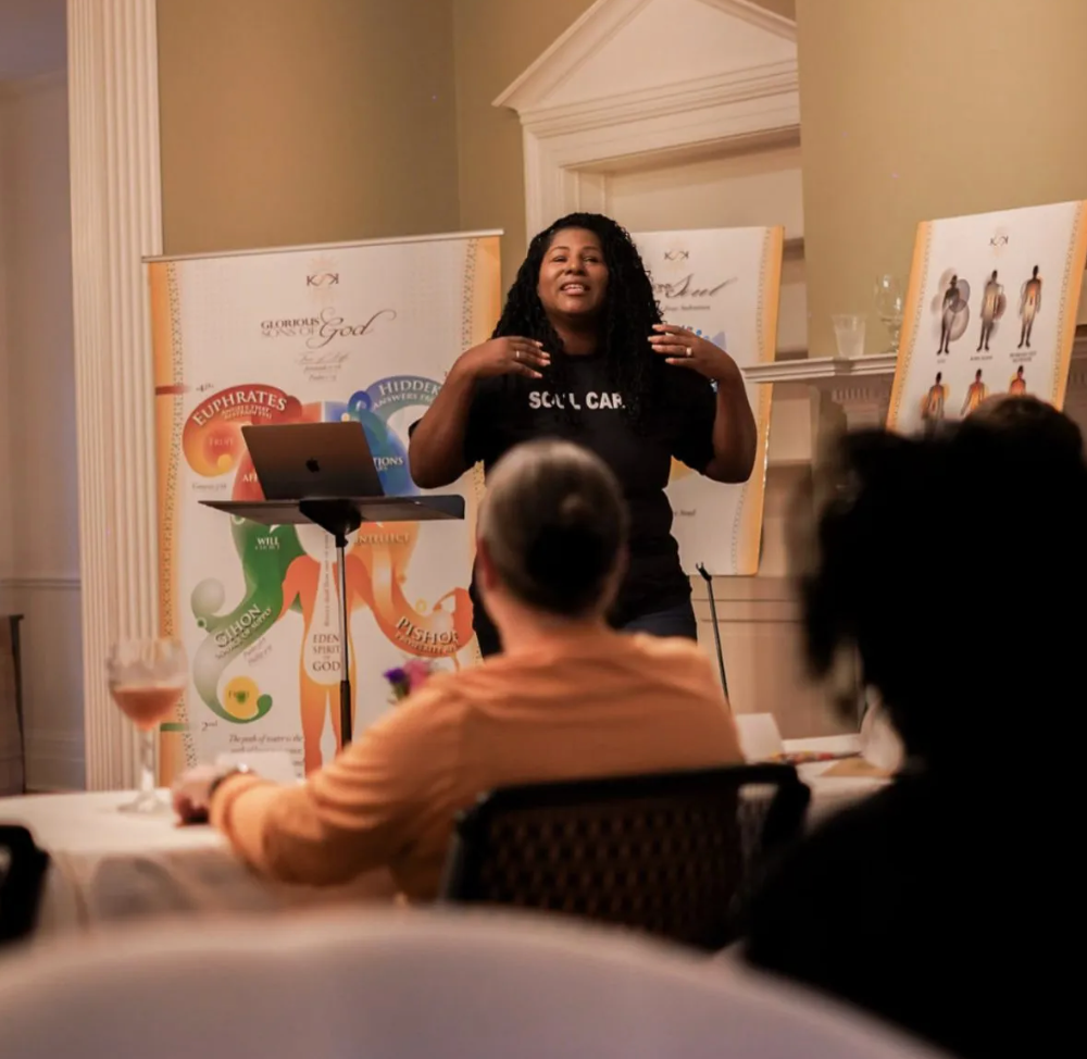 A woman wearing a black shirt with the word skill on it