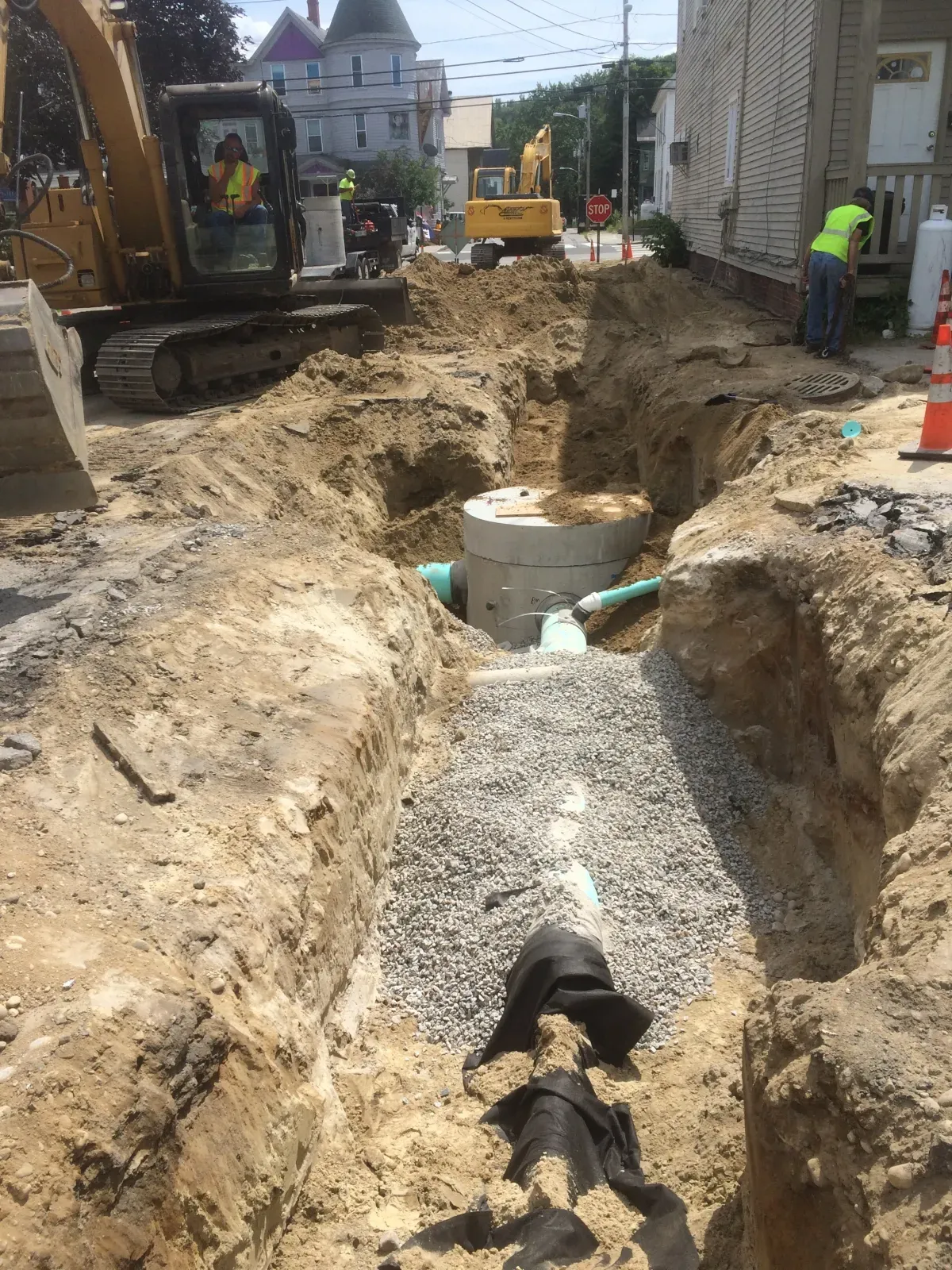 A large excavator is digging a hole in the ground.