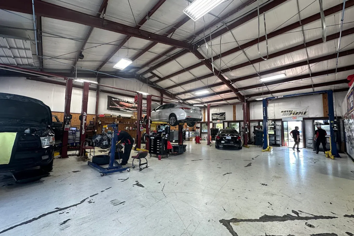 Inside of Auto Shop with Cars for Repair | Chuck's Automotive Repair Inc.