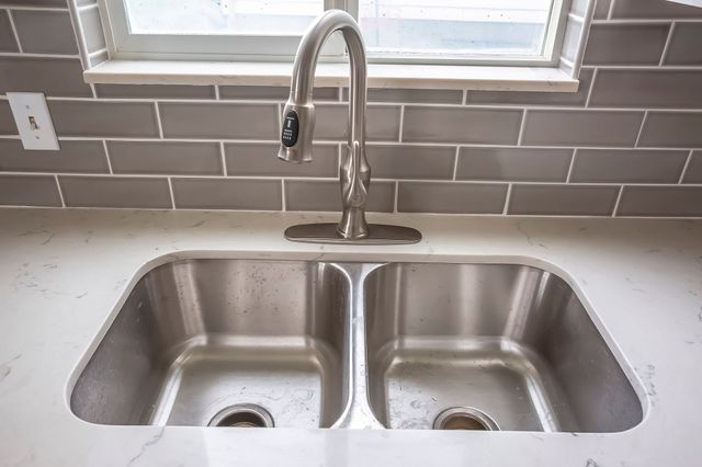 How to Unclog a Double Kitchen Sink With Standing Water