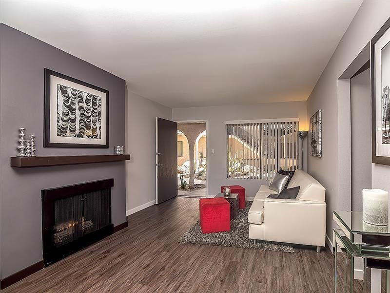 A living room with a fireplace and a couch