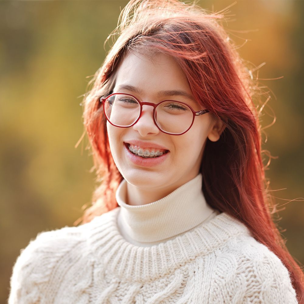 Woman with Red Hair and Glasses – Mary Esther, FL – Primary Eye Care Center