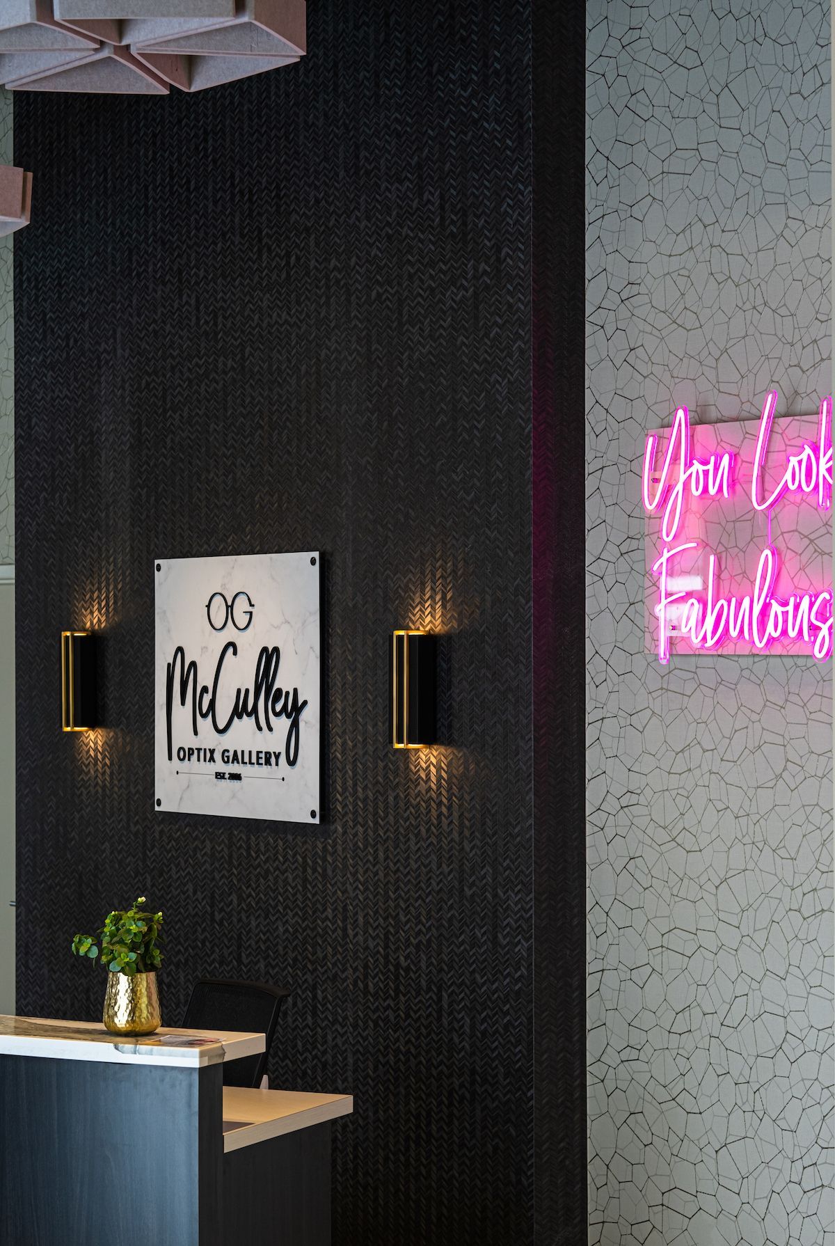 There is a neon sign on the wall that says `` you look fabulous ''.