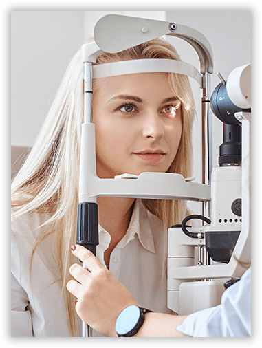 A woman is getting her eyes examined by an ophthalmologist.