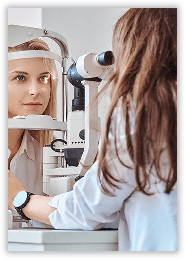 A woman is getting her eyes examined by an ophthalmologist.