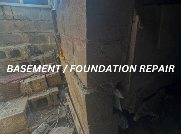 a brick wall with the words basement / foundation repair written on it .