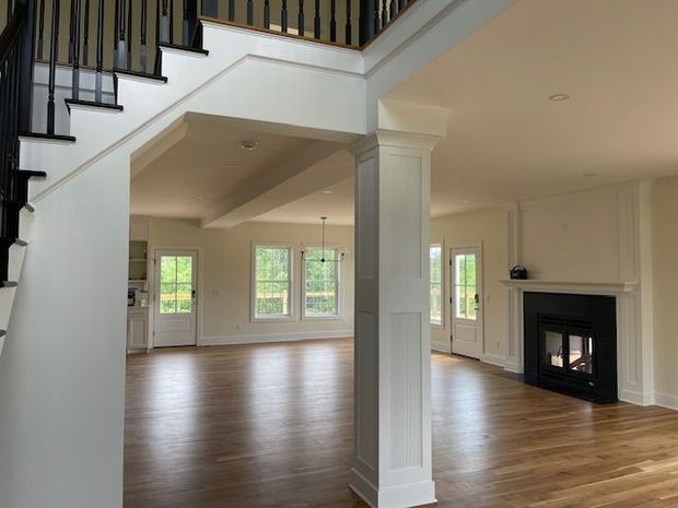 A large house with a lot of windows is being remodeled