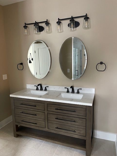 A bathroom is being remodeled with tiles and tools.