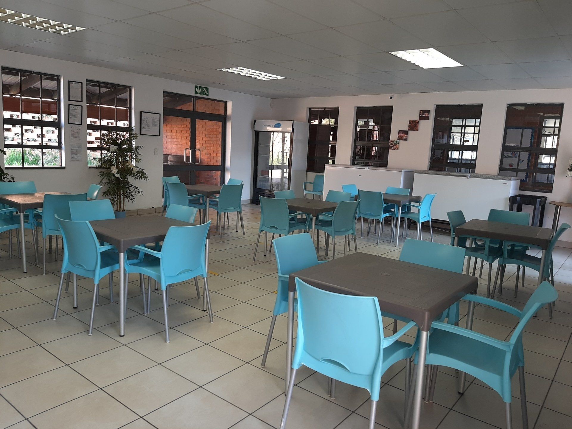 a large room with tables and chairs in it