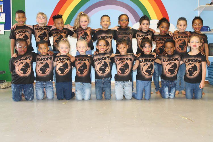 A group of children wearing shirts that say europe
