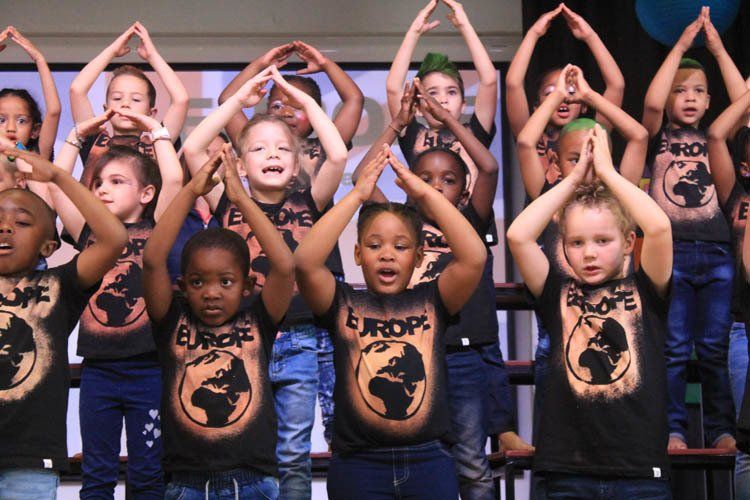 A group of children are wearing shirts that say europe