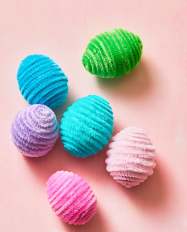 Pink cloth with Easter eggs wrapped in colorful wool