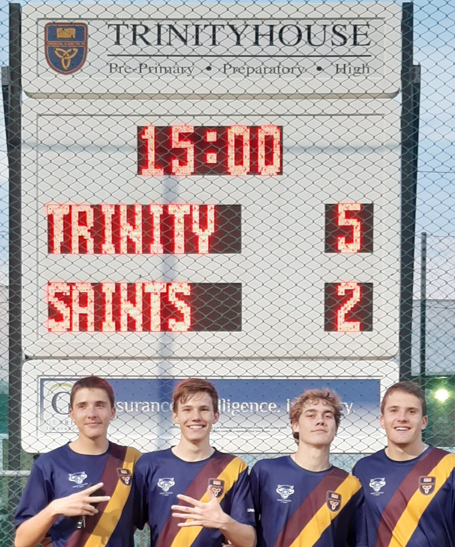 A trinity house scoreboard displays the score of trinity saints 5 to 2