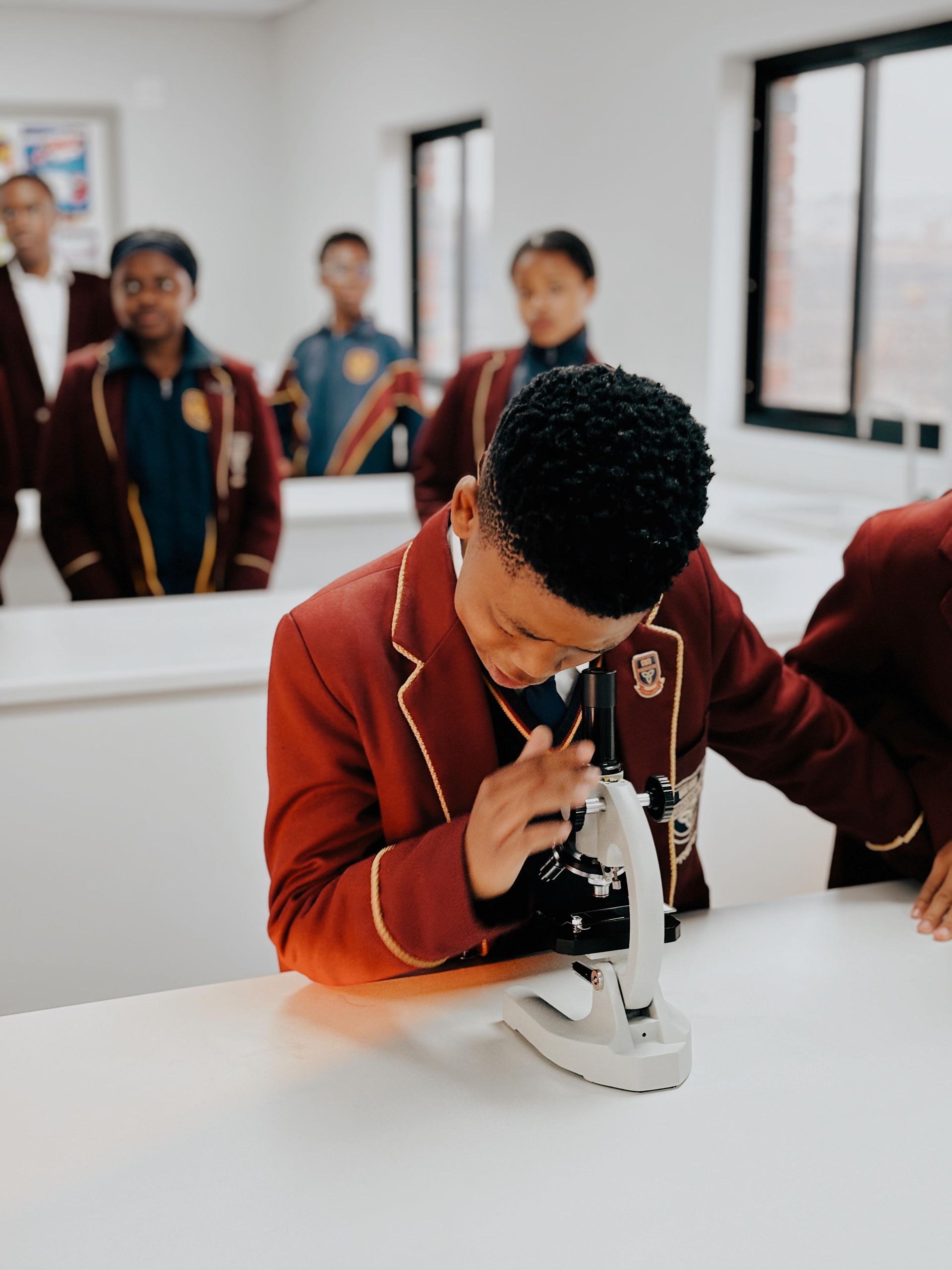 a group of students are standing on a stage