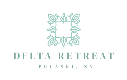 Logo for Delta Retreat in Pulaski, NY, featuring a teal floral square design above text.