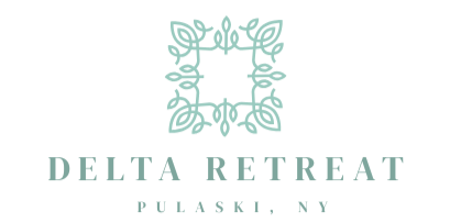Logo for Delta Retreat in Pulaski, NY, featuring a teal floral square design above text.