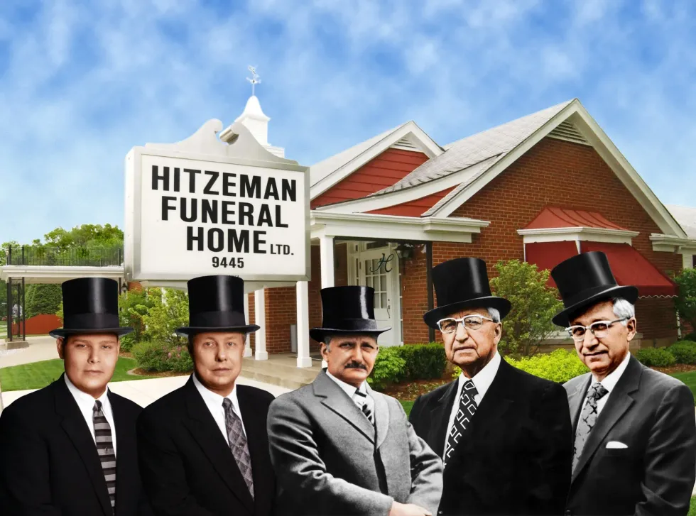 A large office building with a lot of windows on a sunny day.