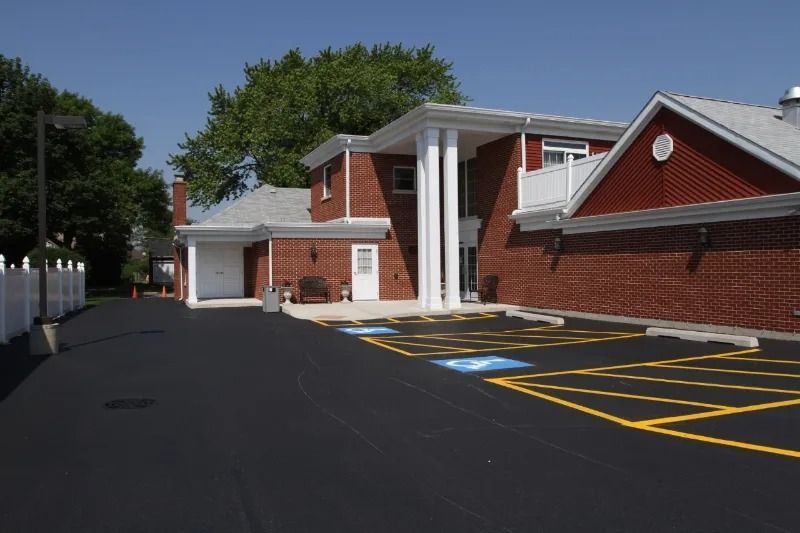 A large office building with a lot of windows on a sunny day.