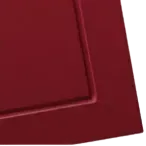 Maroon corner of a rectangular object, with a raised border.