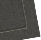 Two dark gray rectangular mats, one atop the other, with a textured surface and visible stitching.