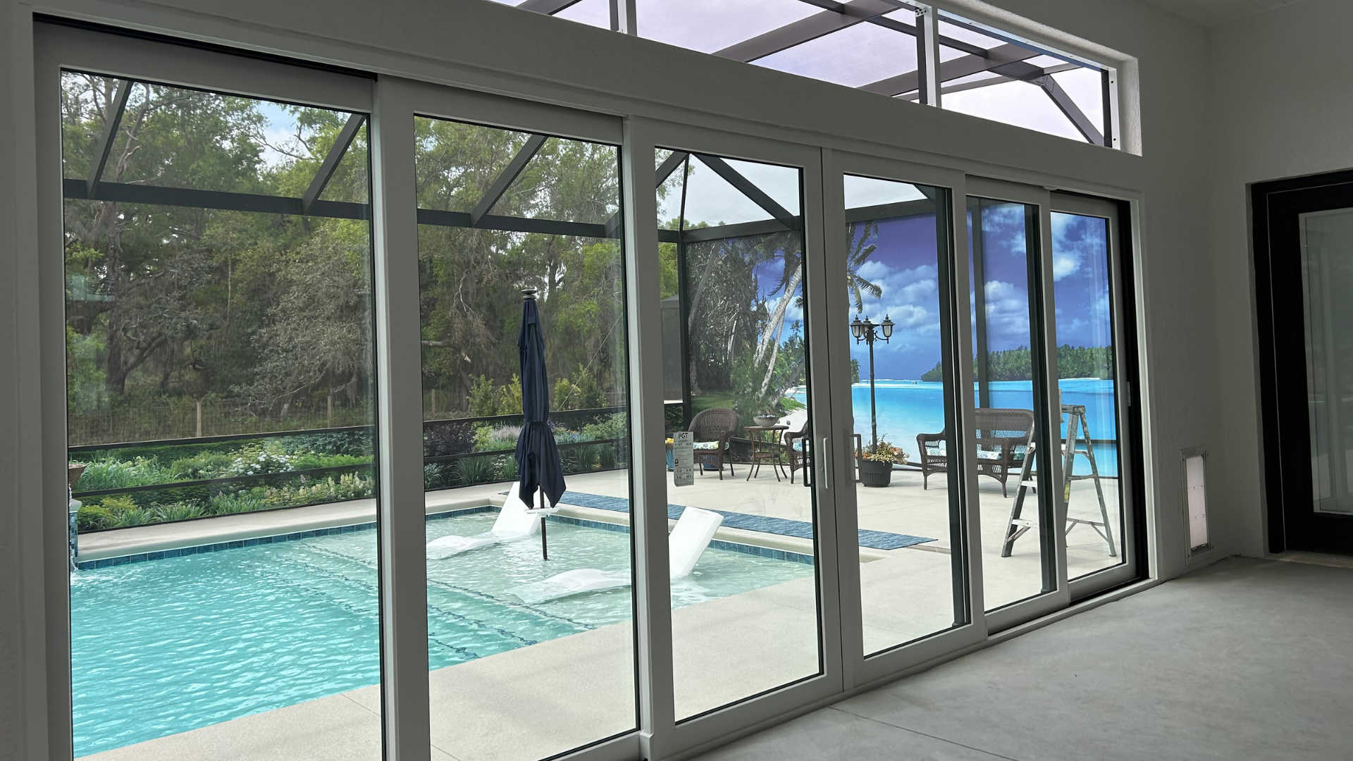 A large window with a view of a swimming pool