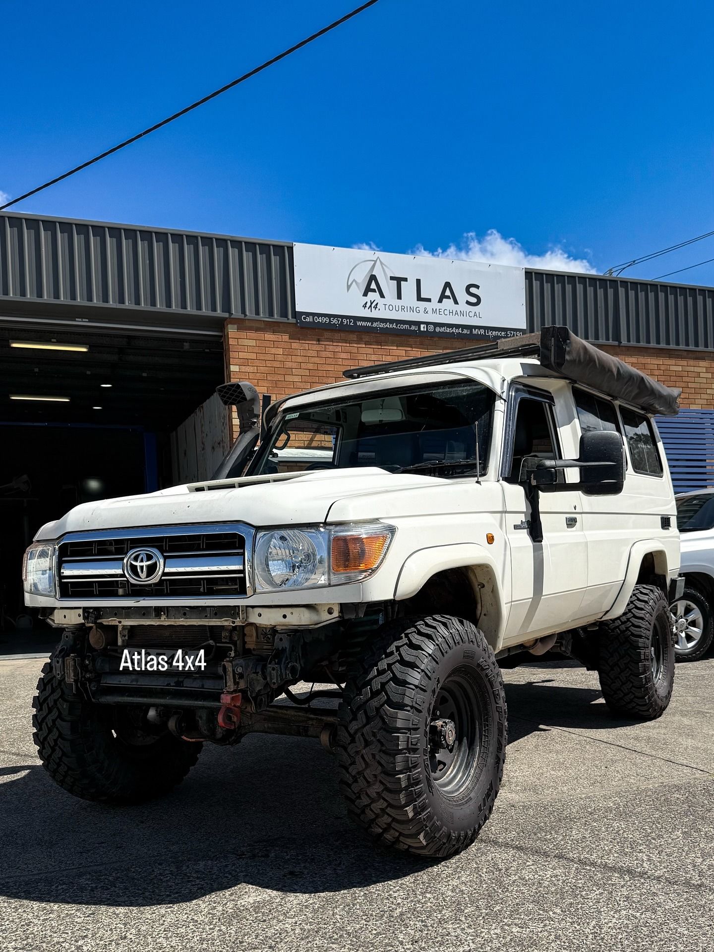 White Toyota Land Cruiser, Heavily Modified for Off-roading — Atlas 4X4 Touring & Mechanical in Tweed Heads, NSW
