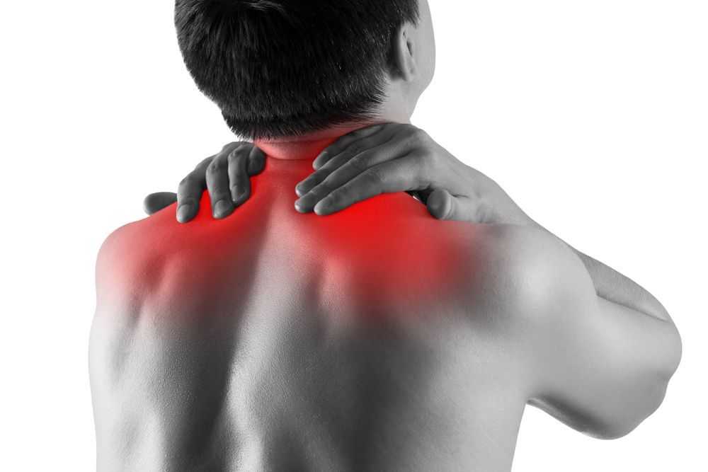 Black And White Image of A Man's Back With Neck Glowing Red To Show Pain — Southern Districts Physiotherapy & Sports Injuries Clinic In Albion Park, NSW
