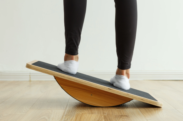 Someone Is On A Balance Board — Southern Districts Physiotherapy & Sports Injuries Clinic In Albion Park, NSW