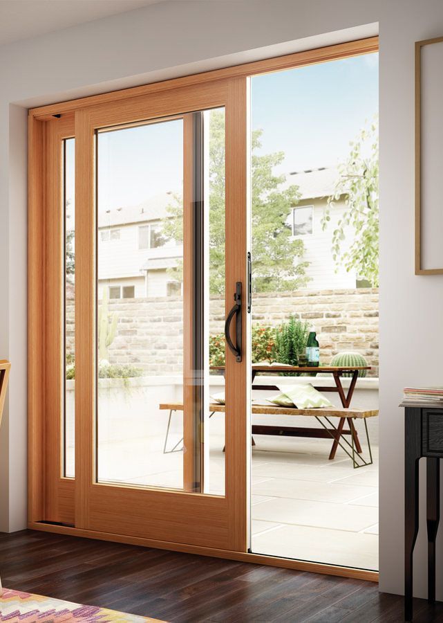 A room with a sliding glass door leading to a patio in Doylestown, PA.