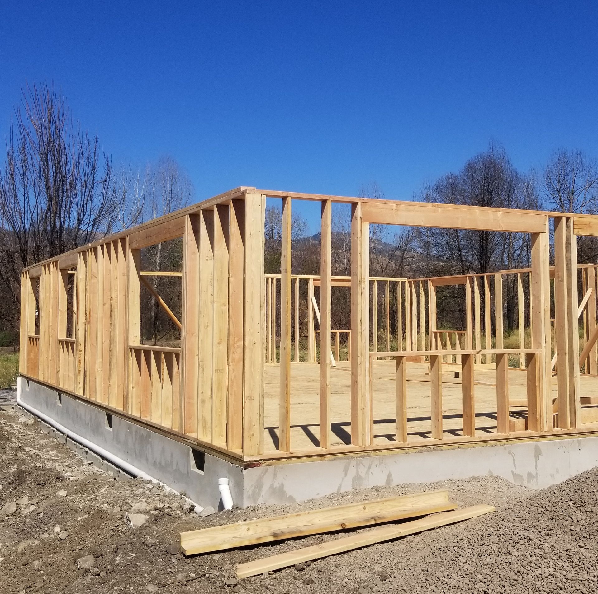 A brick chimney on top of a metal roof