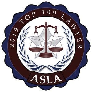 2019 Top 100 Lawyer award badge, featuring scales of justice, laurels, and