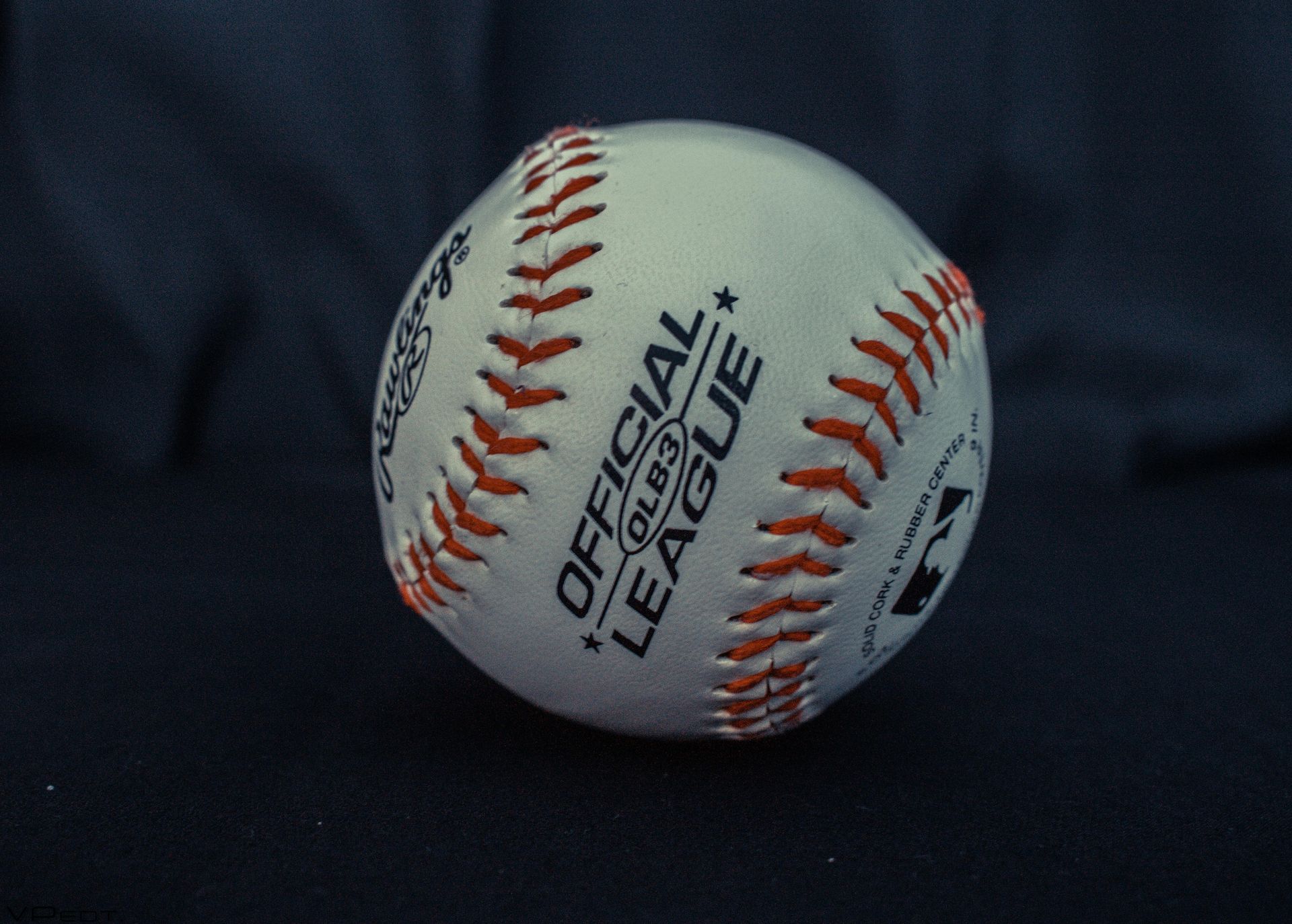 A baseball that says official league on it