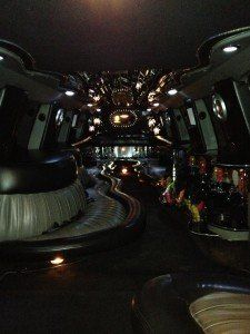 The inside of a limousine with a lot of lights on the ceiling.