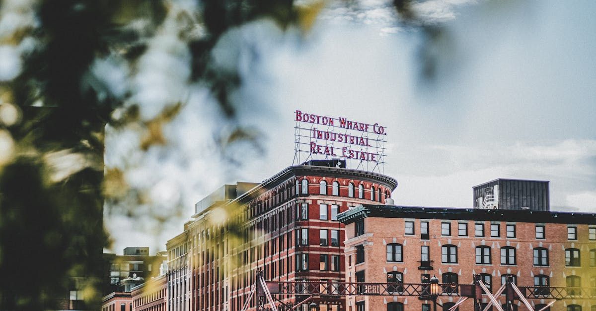 A large brick building with a sign on top of it.