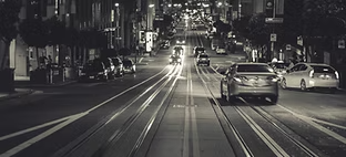 picture of cars driving on city street | Gramenzi Auto Service