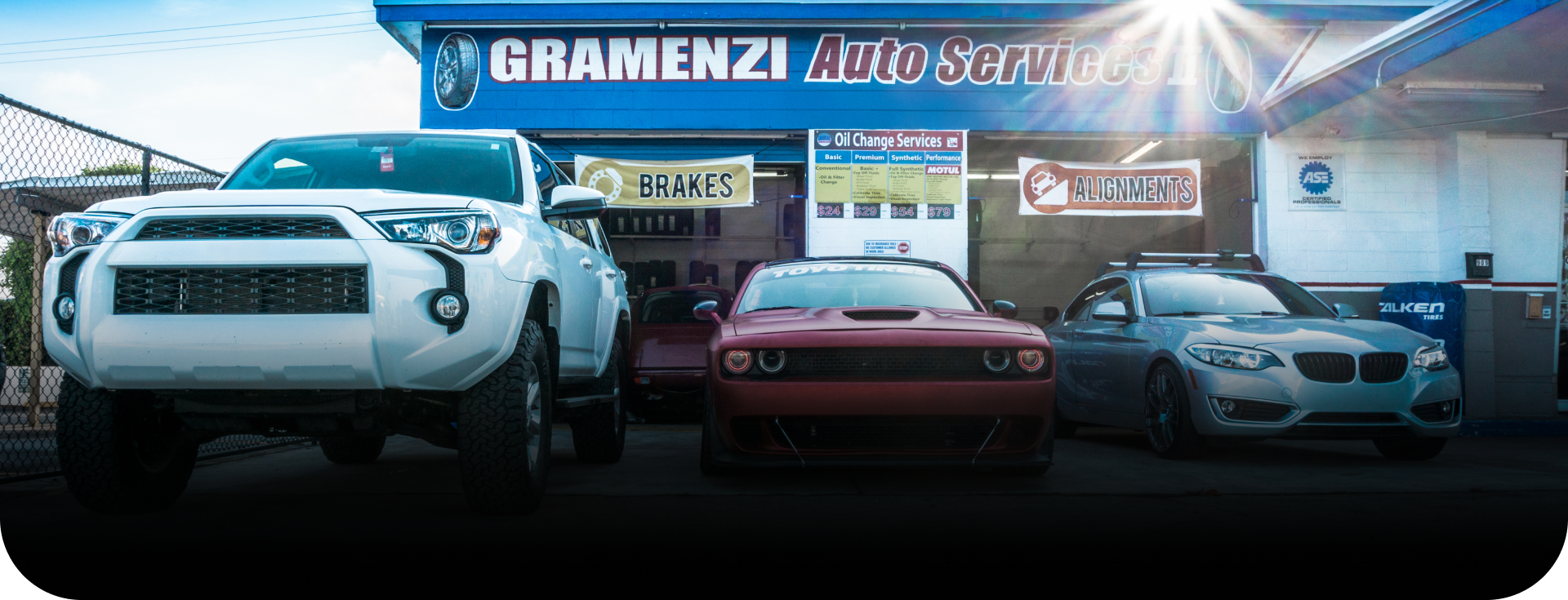 shop front with 3 parked cars | Gramenzi Auto Services