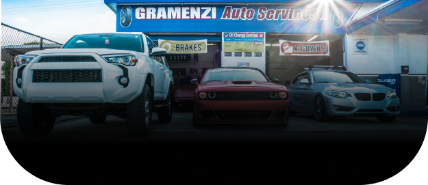 shop front with 3 parked cars | Gramenzi Auto Services